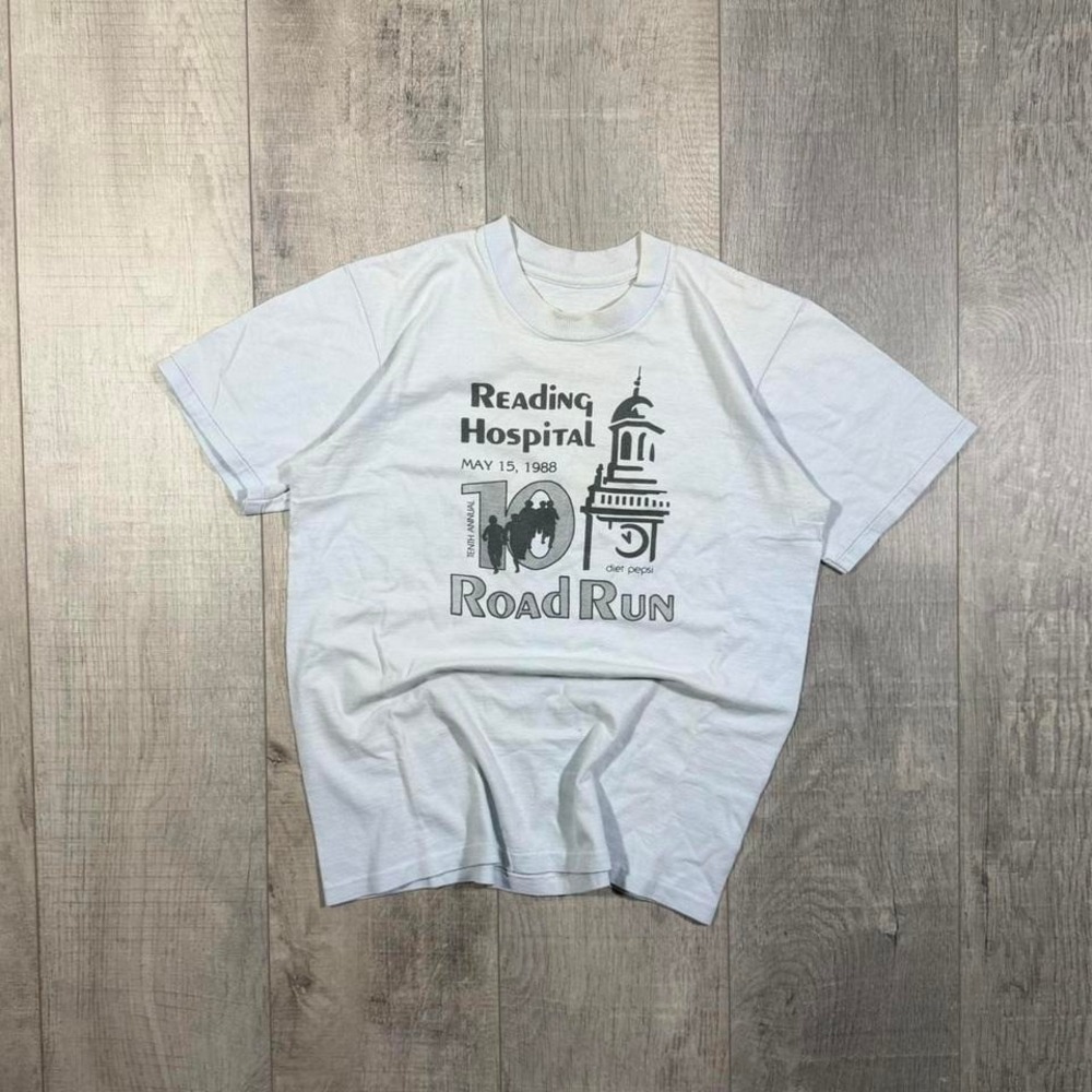Women's vintage single stitch 80s baby blue and black reading running tee